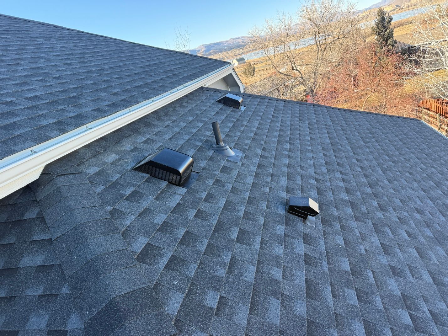 A close up of a roof with a roof vent on it.