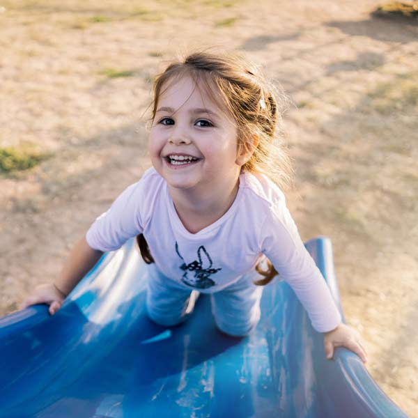 Playing on a Slide at a Playground — Mitcham, Vic — Emmikins ELC