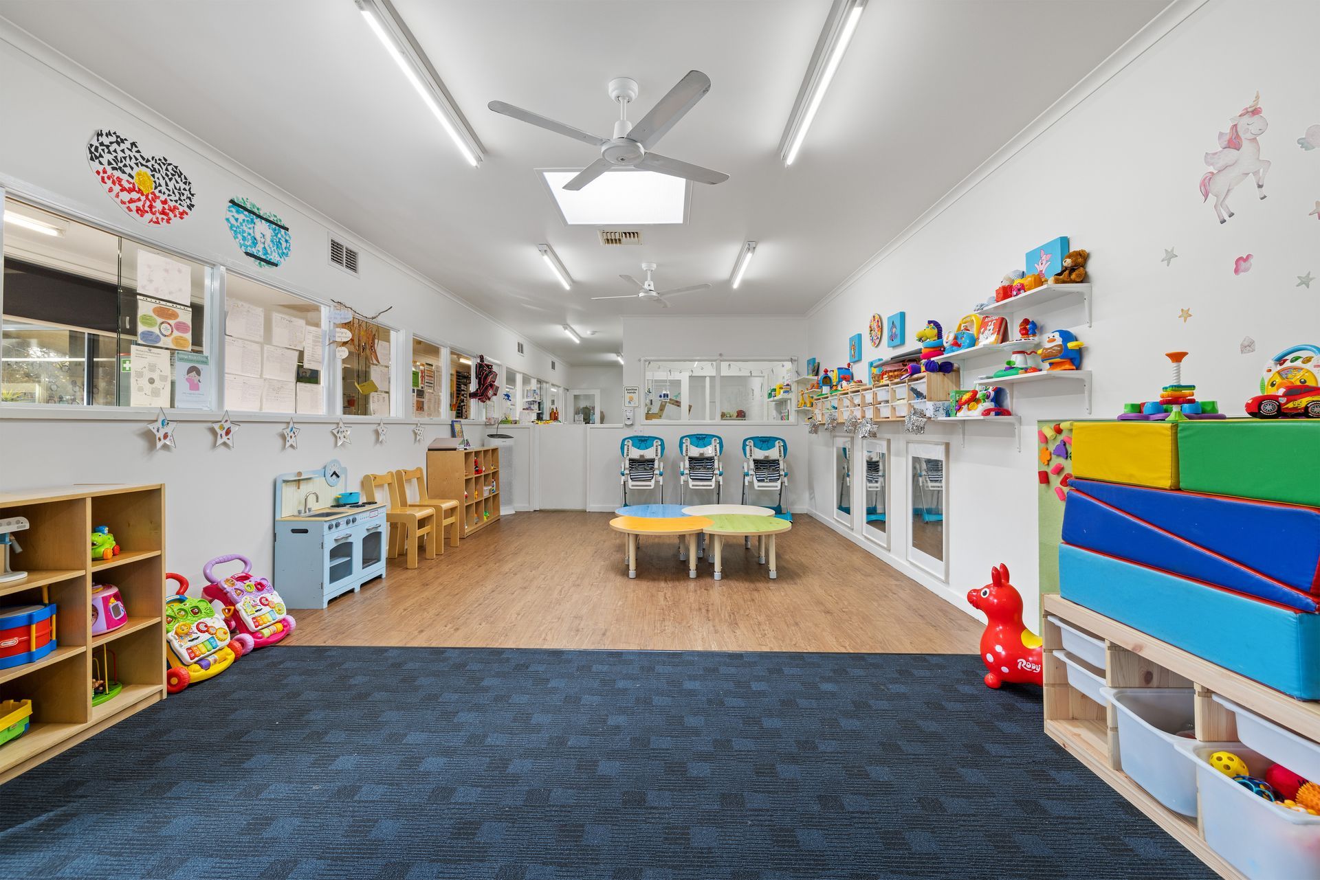 Happy Toddler Girl Playing with Crayons — Mitcham, Vic — Emmikins ELC