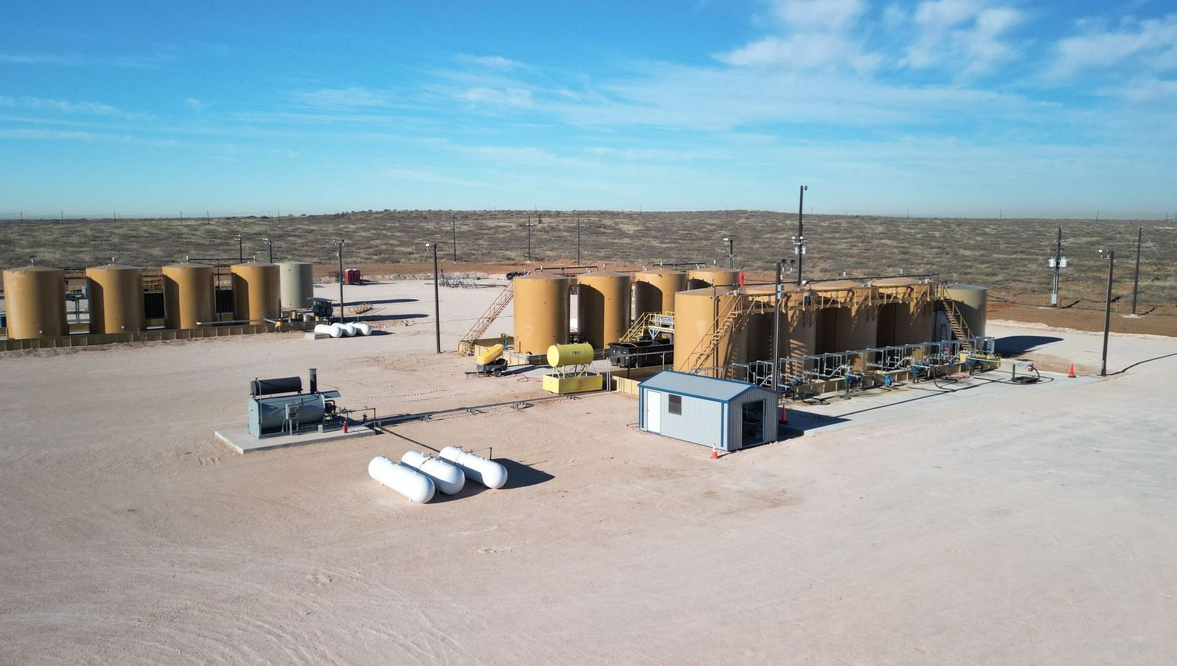 An aerial view of a gas station in the desert