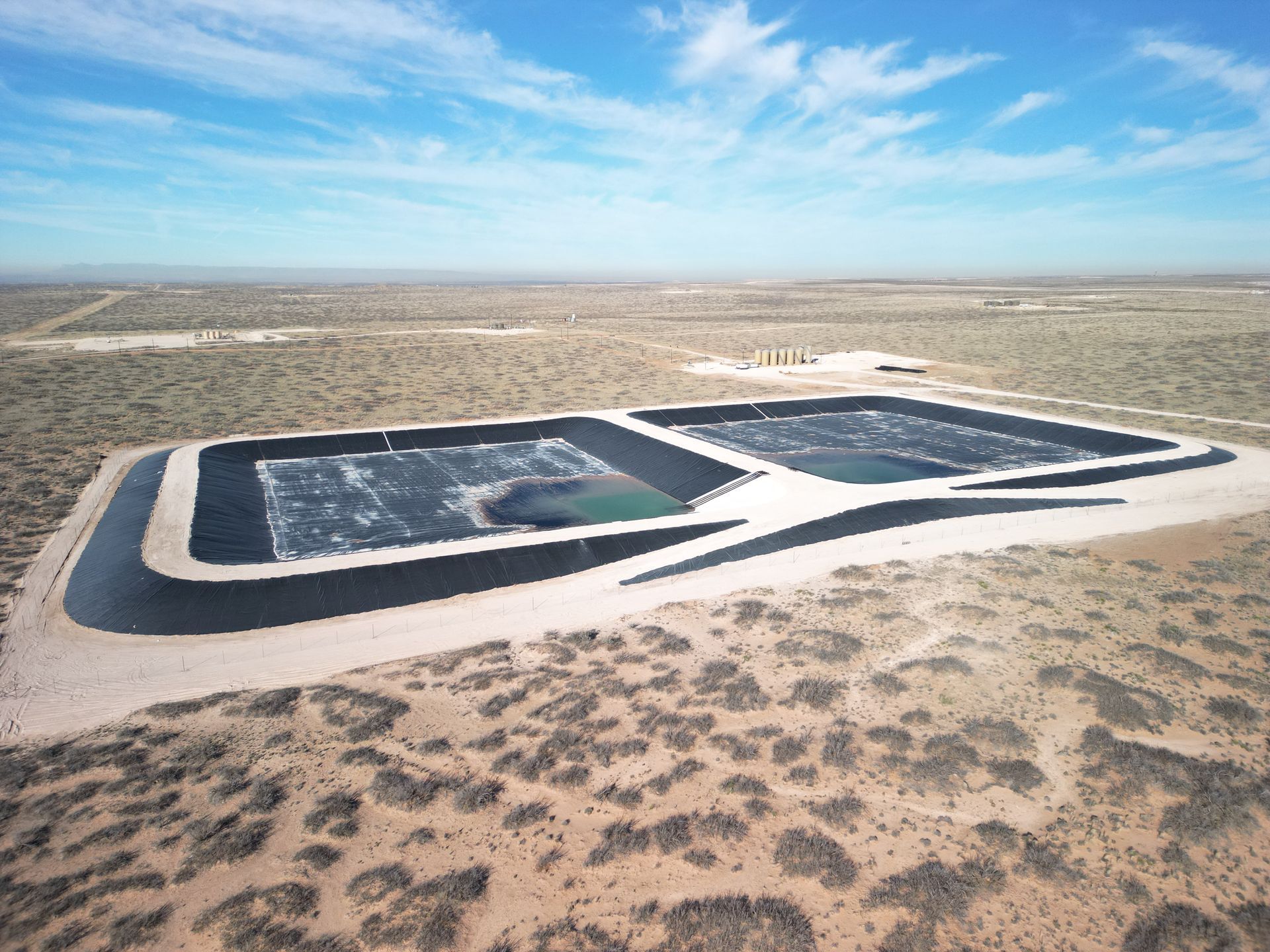 An aerial view of a large body of water in the middle of a desert.