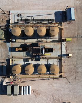 An aerial view of an Oilfield with a lot of tanks