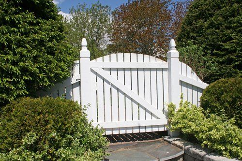 White wooden gate leading into the garden