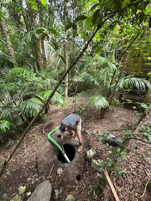 Man is Working on a Septic Tank in the Woods — Tweed Valley Septics & Liquid Waste Management in South Murwillumbah, NSW