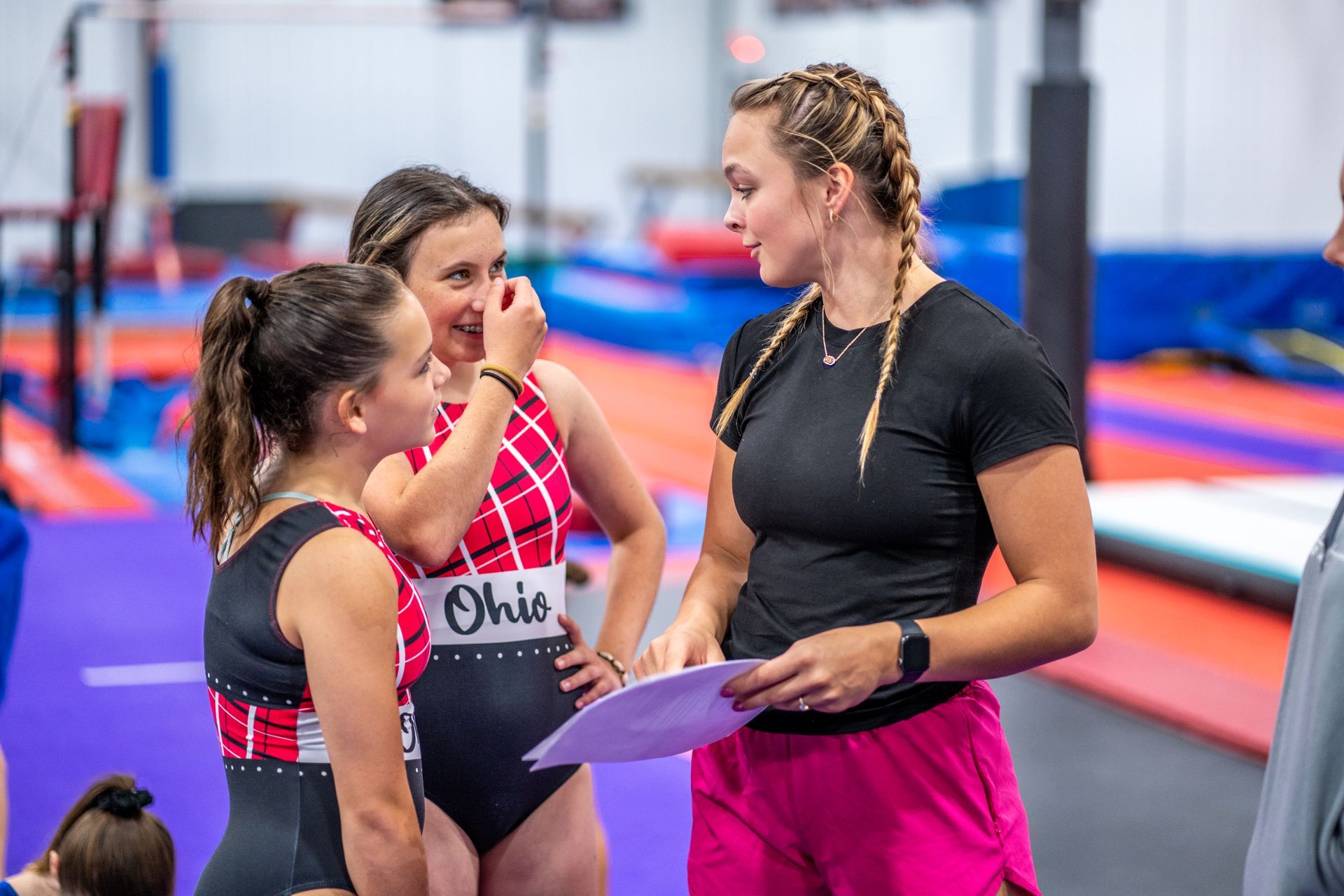 Coach talking with gymnasts