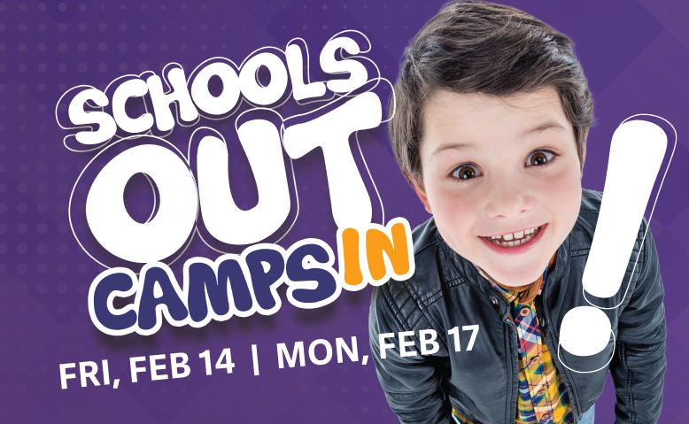 A young boy is smiling in front of a sign that says schools out camps in