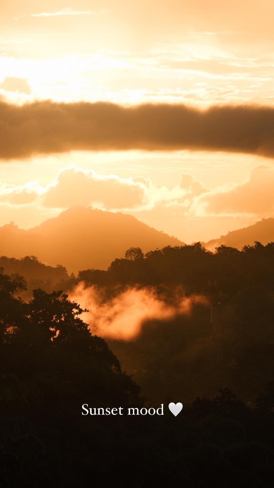 A picture of a sunset with the words sunset mood