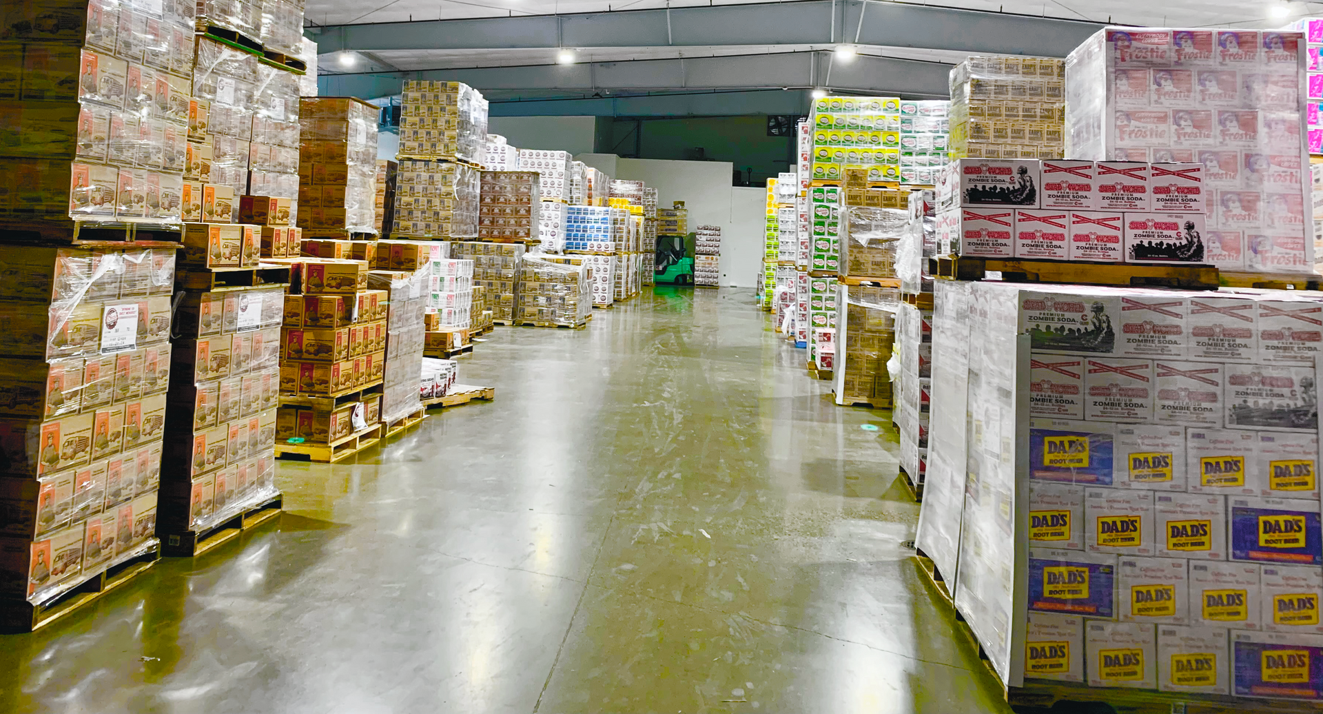 A large warehouse filled with lots of boxes and pallets.