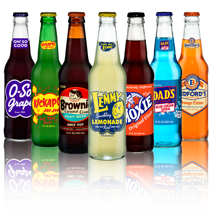 A group of soda bottles sitting next to each other on a table.