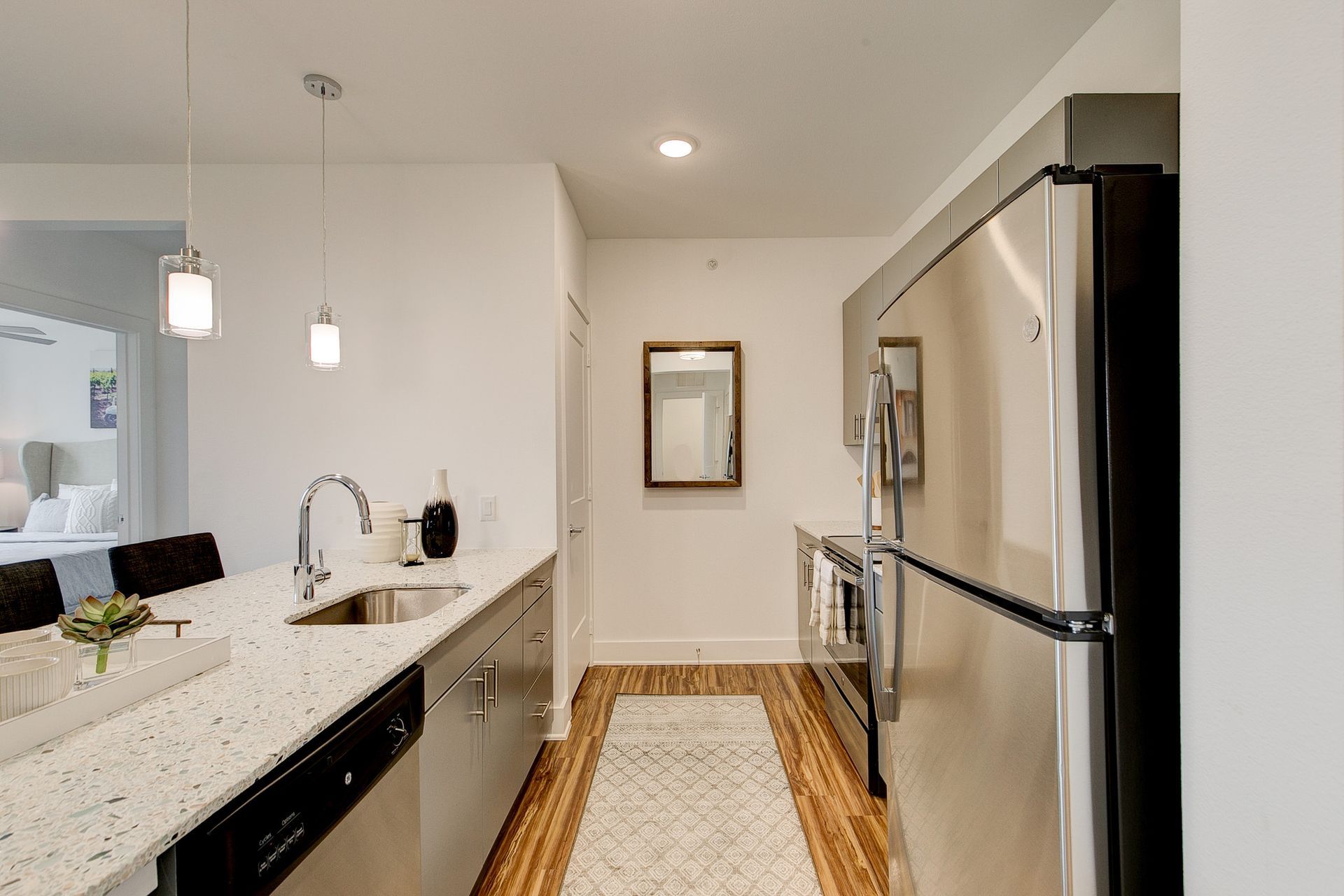 A kitchen with stainless steel appliances and granite counter tops
