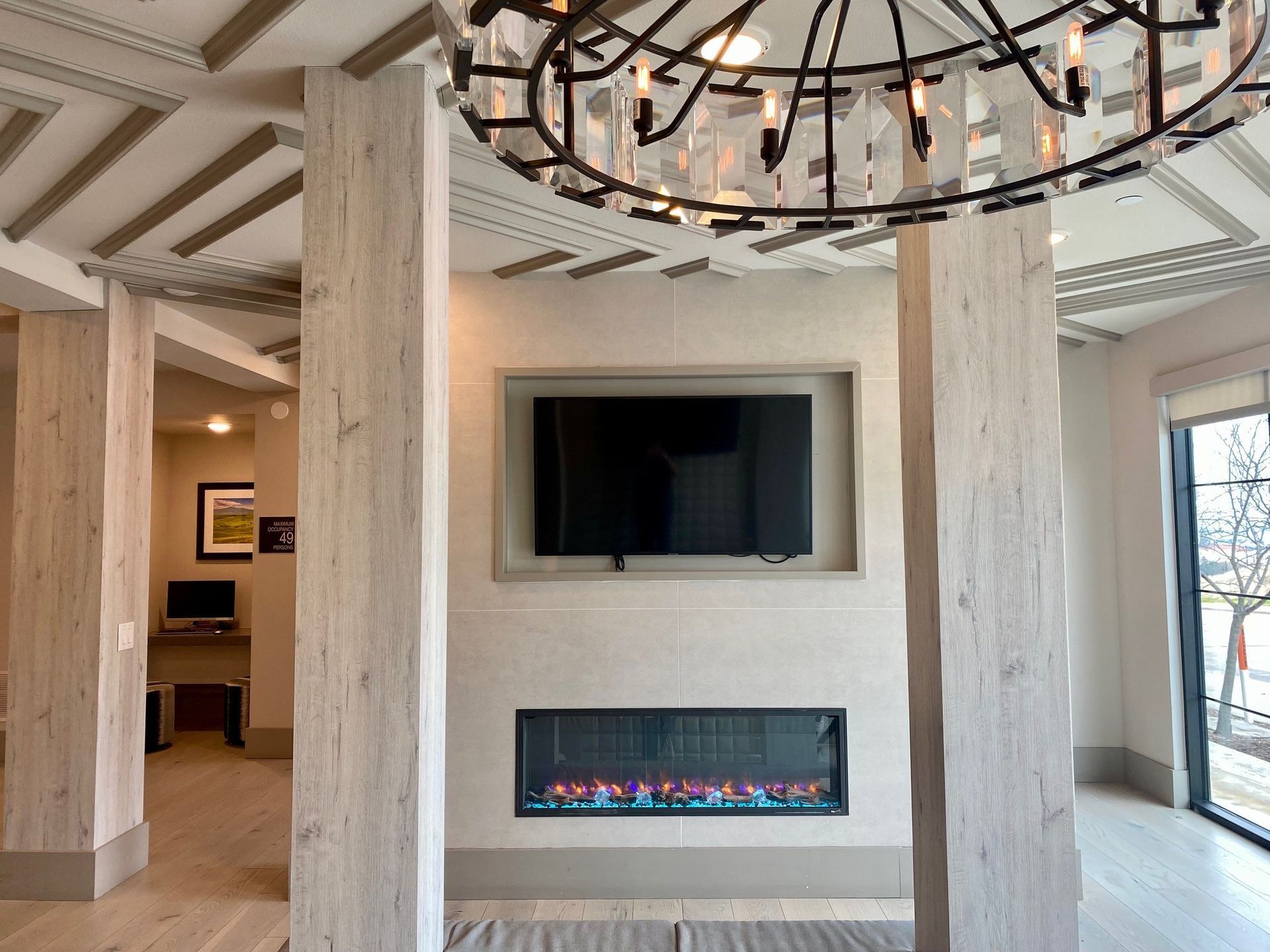 TV and fireplace in lounge area of lobby