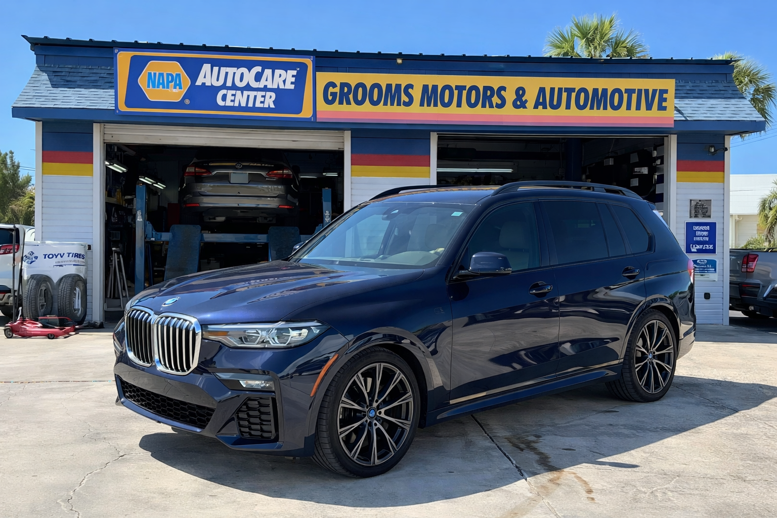 BMW X7 in front of Grooms Motors Shop | Grooms Motors & Automotive