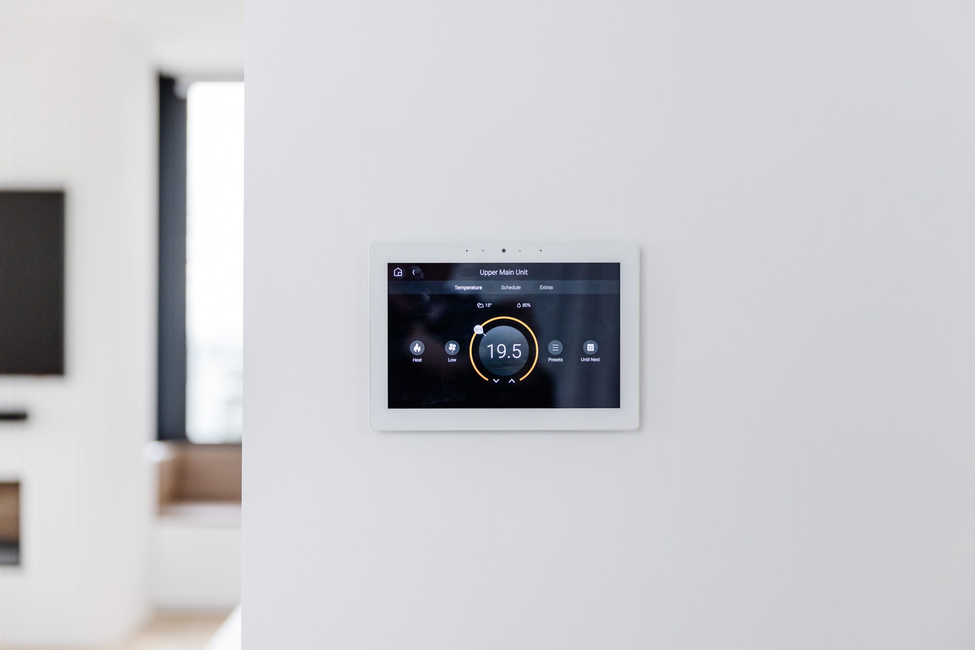 Ducted air conditioning control panel on living room wall