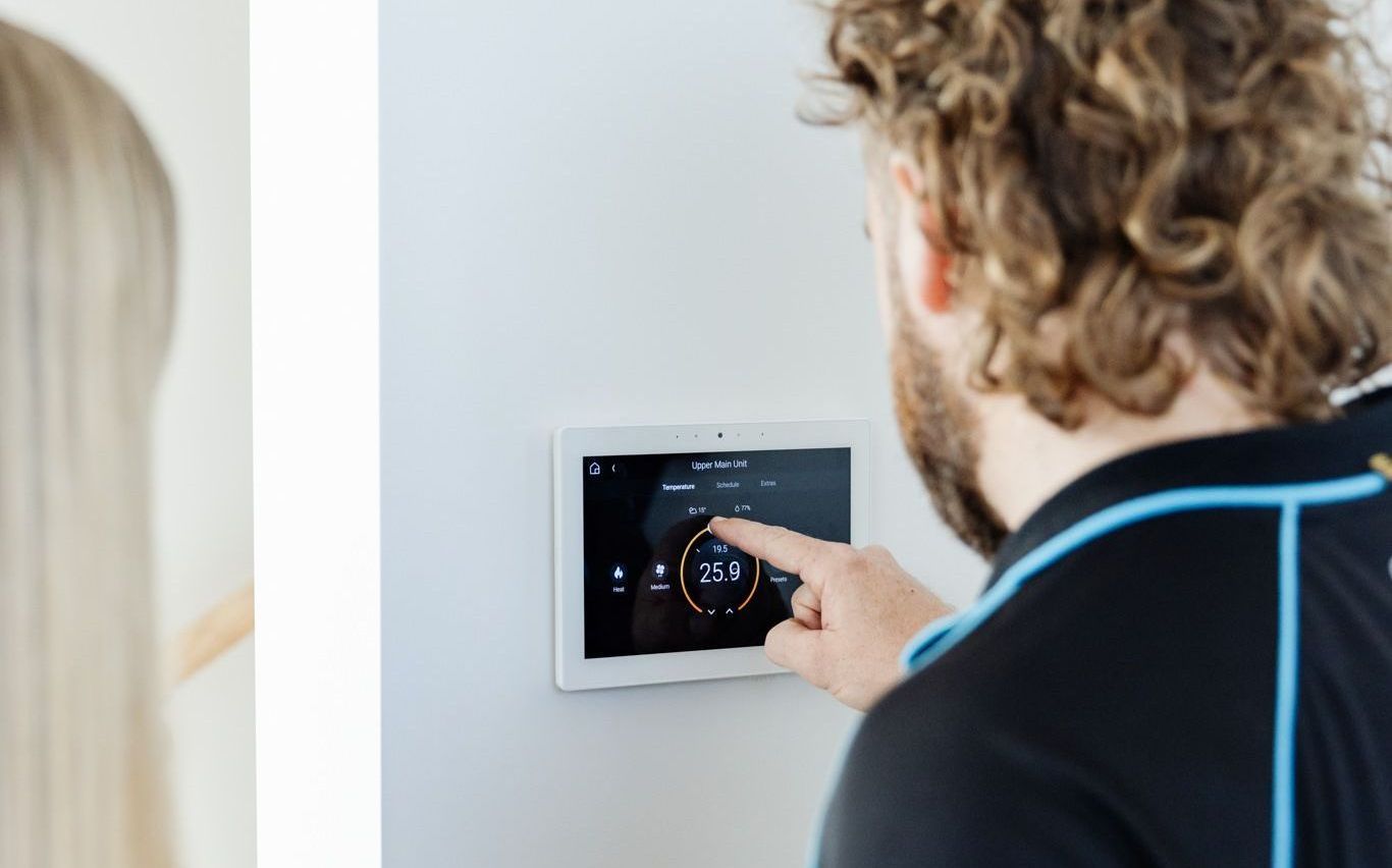 Win Air & Electrical installing an AC vent.