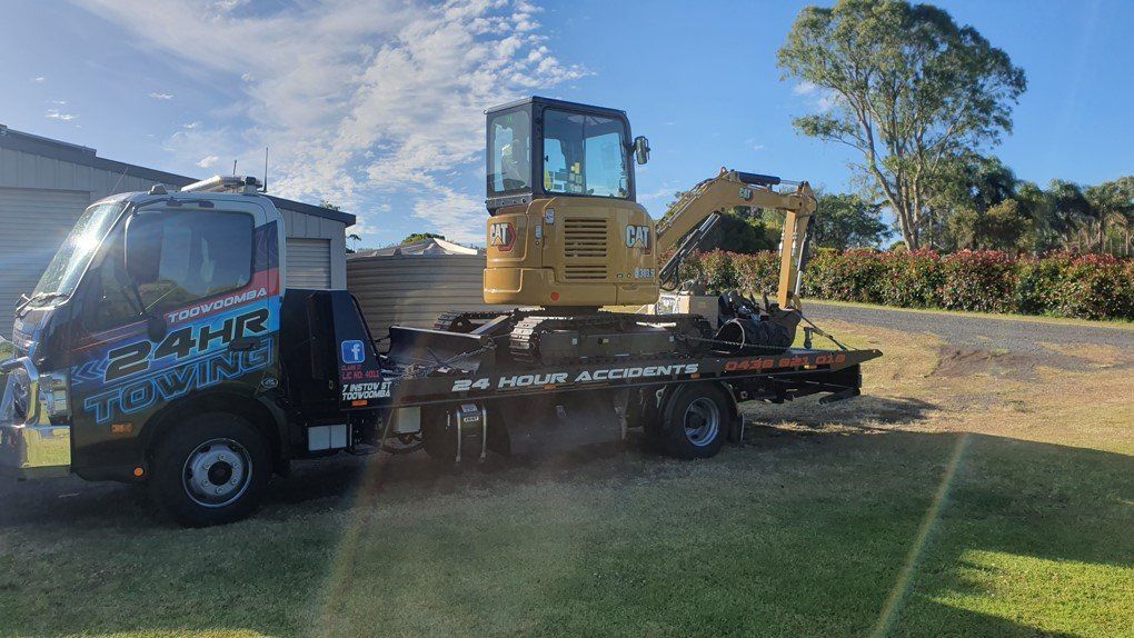 Towing A Yellow Excavator — Toowoomba 24hr Towing In Toowoomba QLD