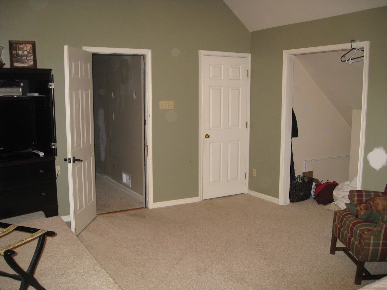 A living room with a chair and a television