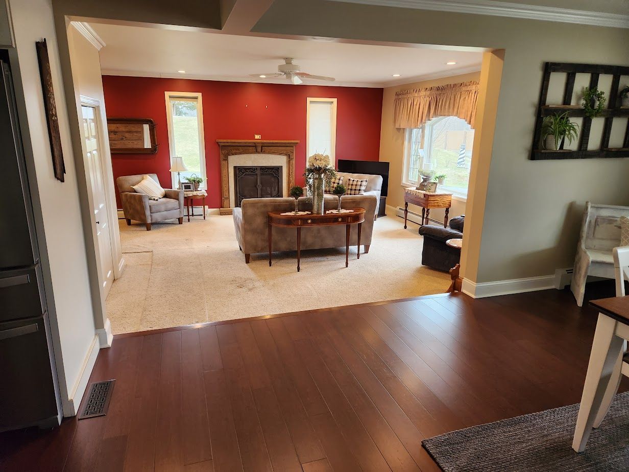 A living room filled with furniture and a fireplace