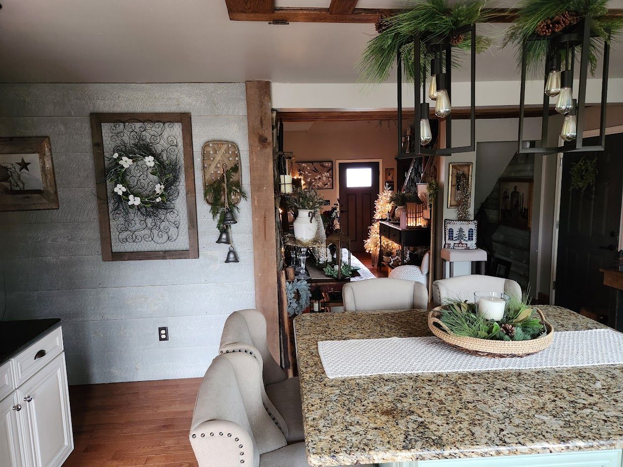 A kitchen with a granite counter top and a dining table.