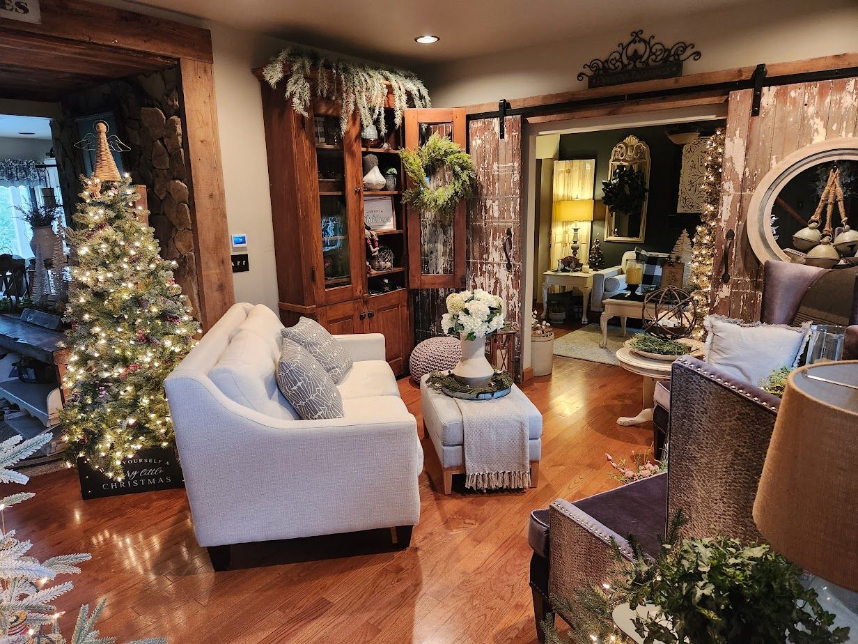 A living room filled with furniture and a christmas tree