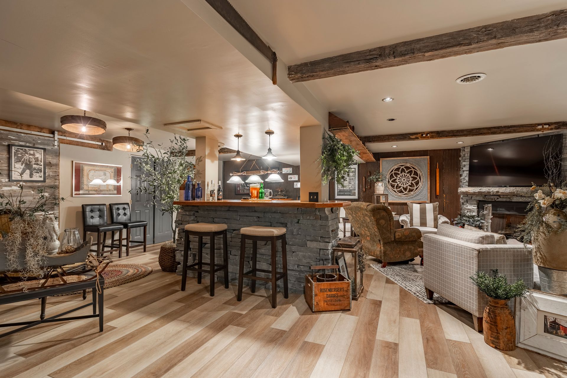 A living room filled with furniture and a bar.