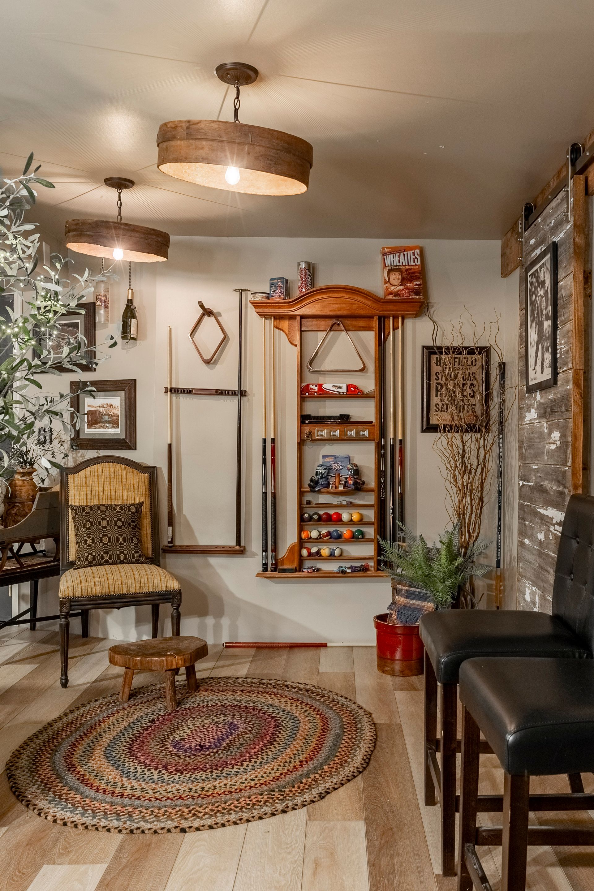 A living room filled with furniture and a pool table.