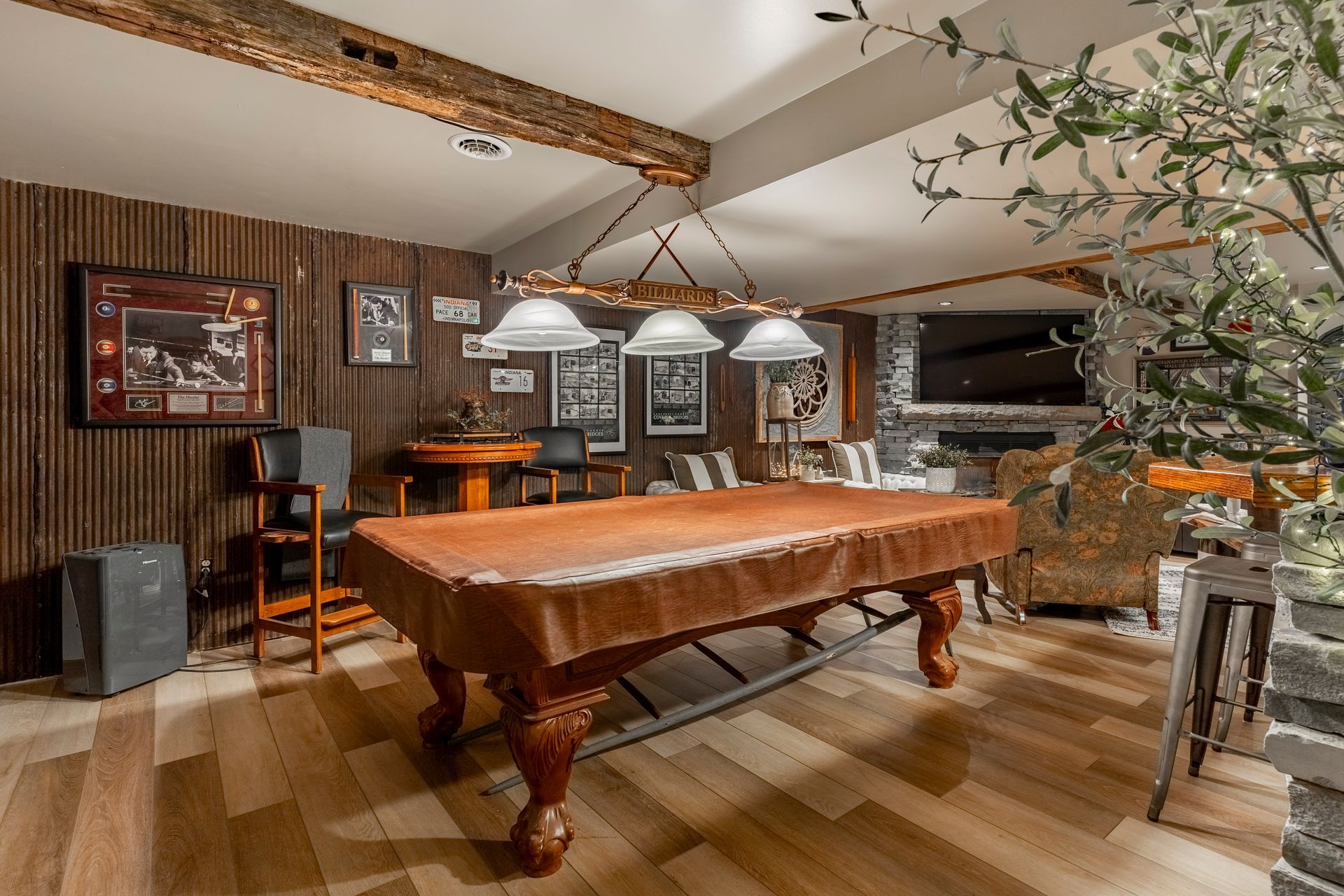 There is a pool table in the middle of the room.