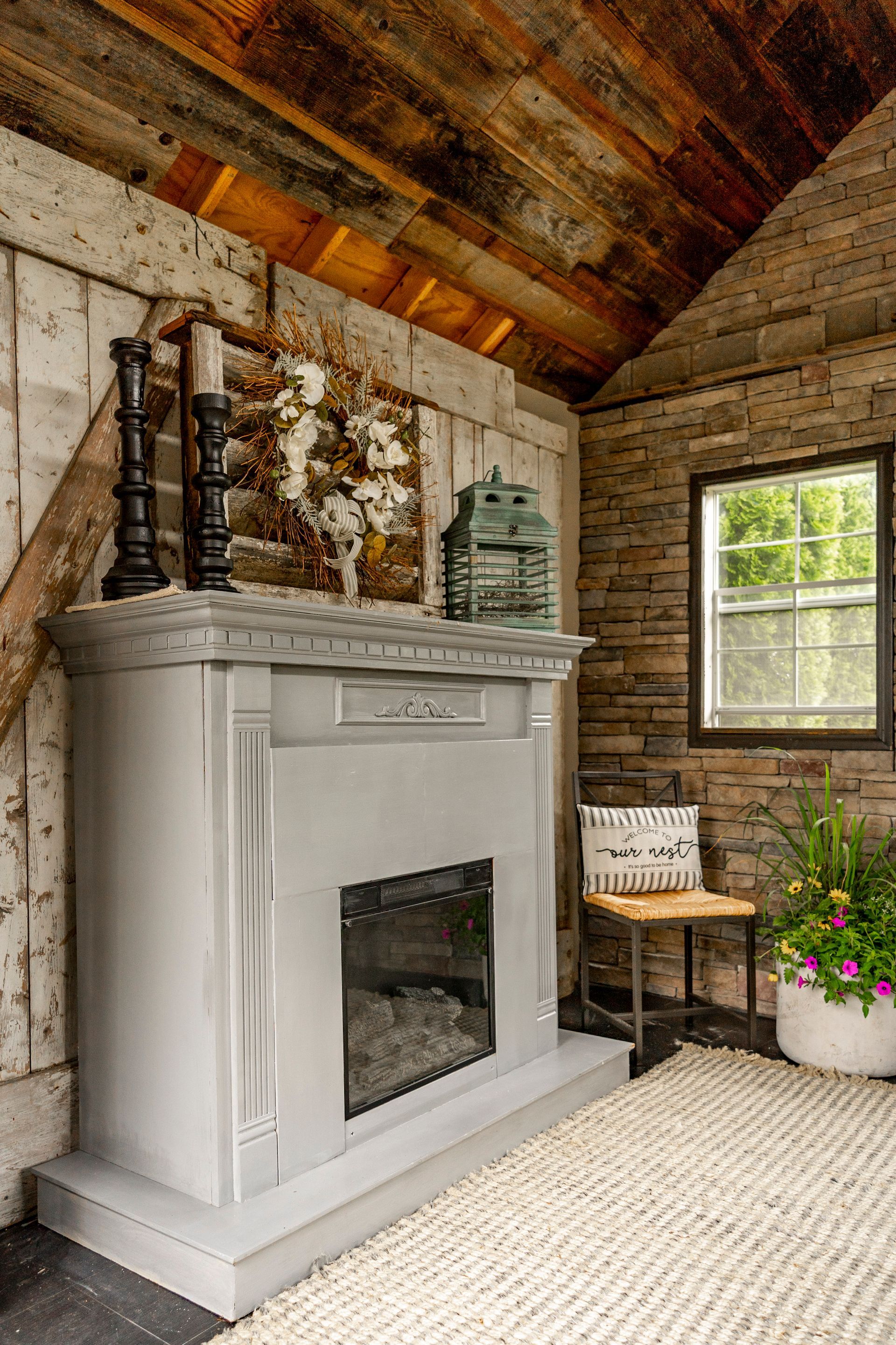 There is a fireplace in the middle of the room.