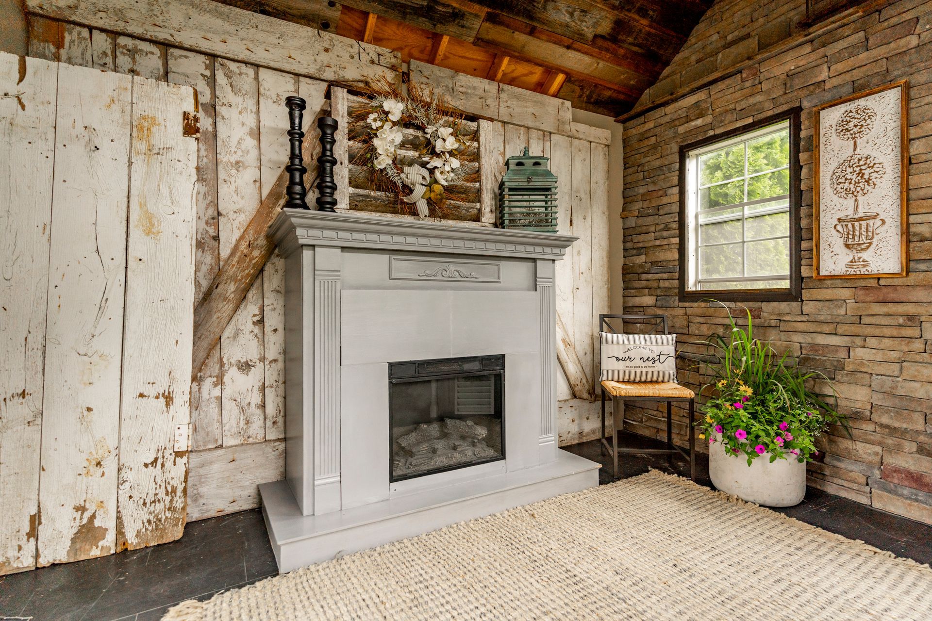 There is a fireplace in the middle of the room.