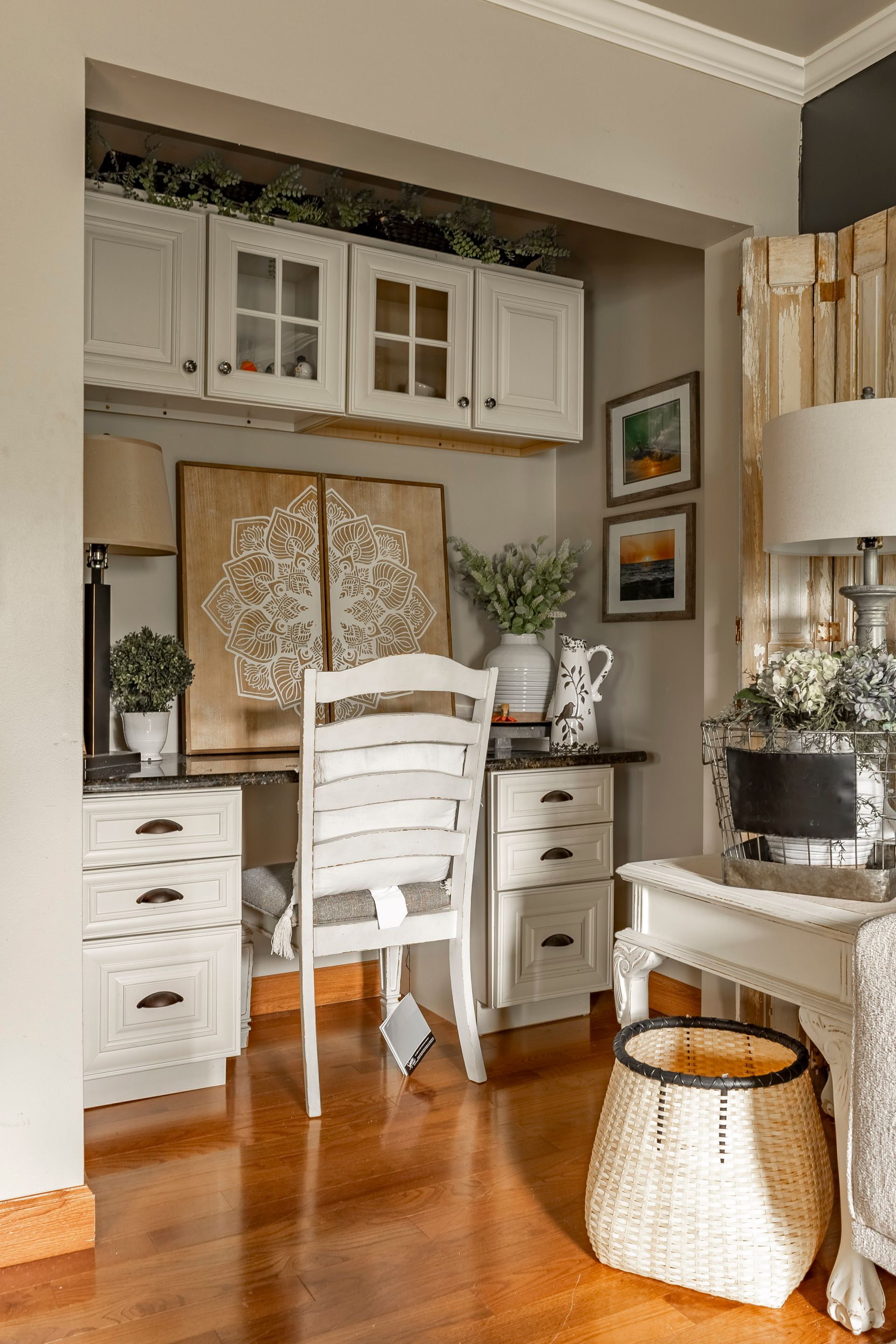 There is a desk and chair in the corner of the room.