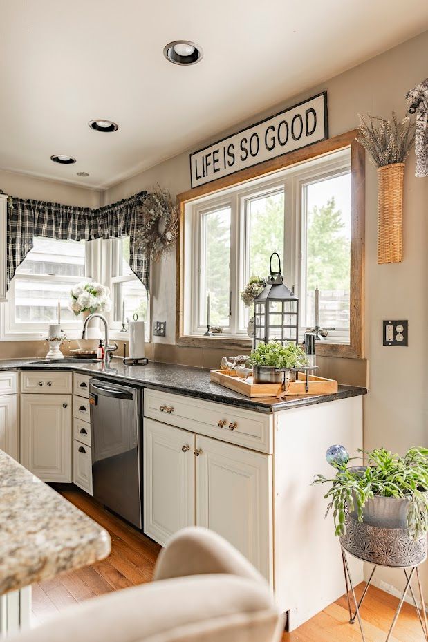 A kitchen with a sign on the wall that says `` life is so good ''.