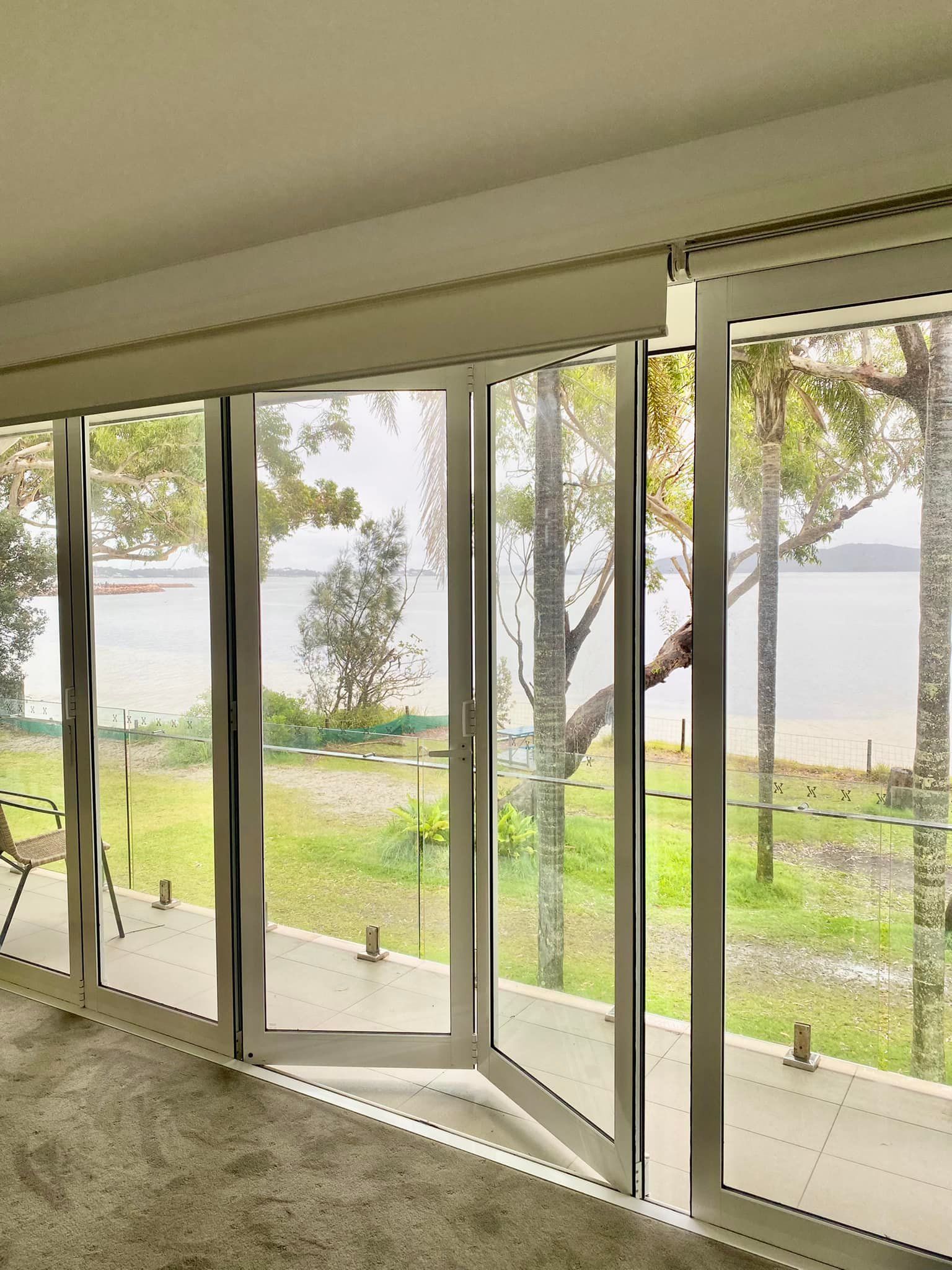 Large Glass Doors Open to a Waterfront View — Fix-A-Door in Morisset, NSW