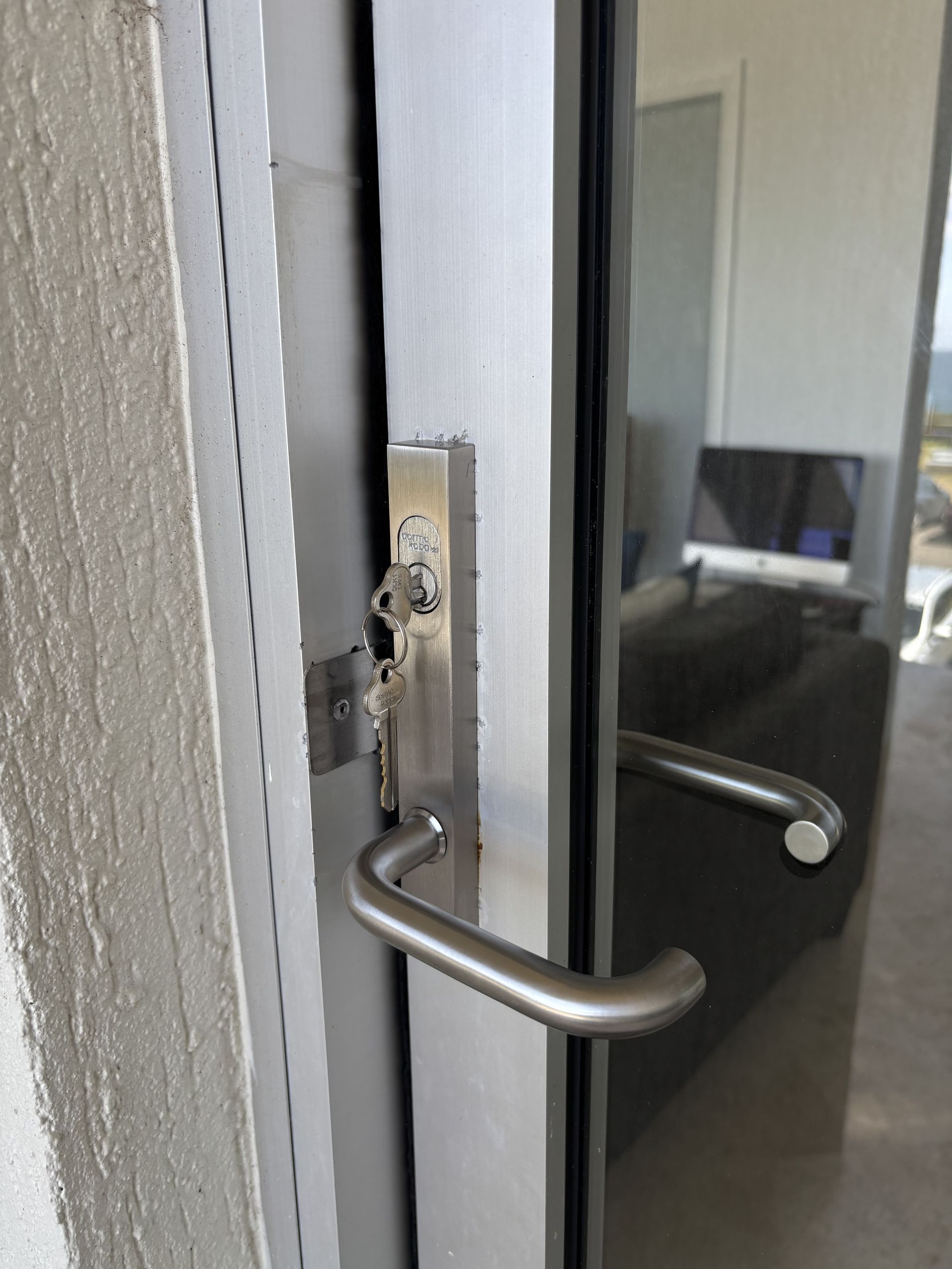 Close-up Of A Door Handle And Lock With A Key Inserted — Fix-A-Door in Wyong, NSW