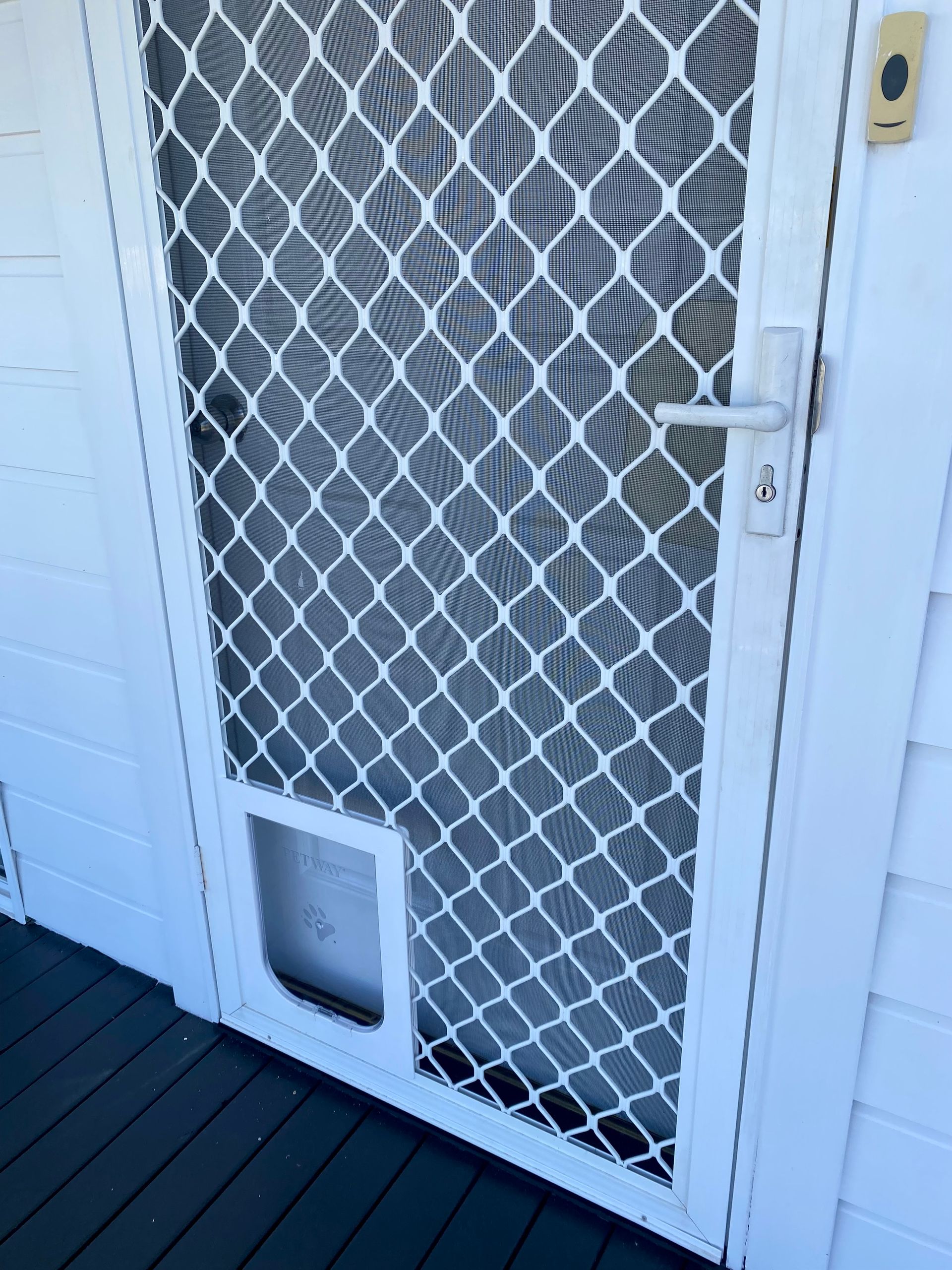 White Screen Door With A Pet Door — Fix-A-Door in Cessnock, NSW
