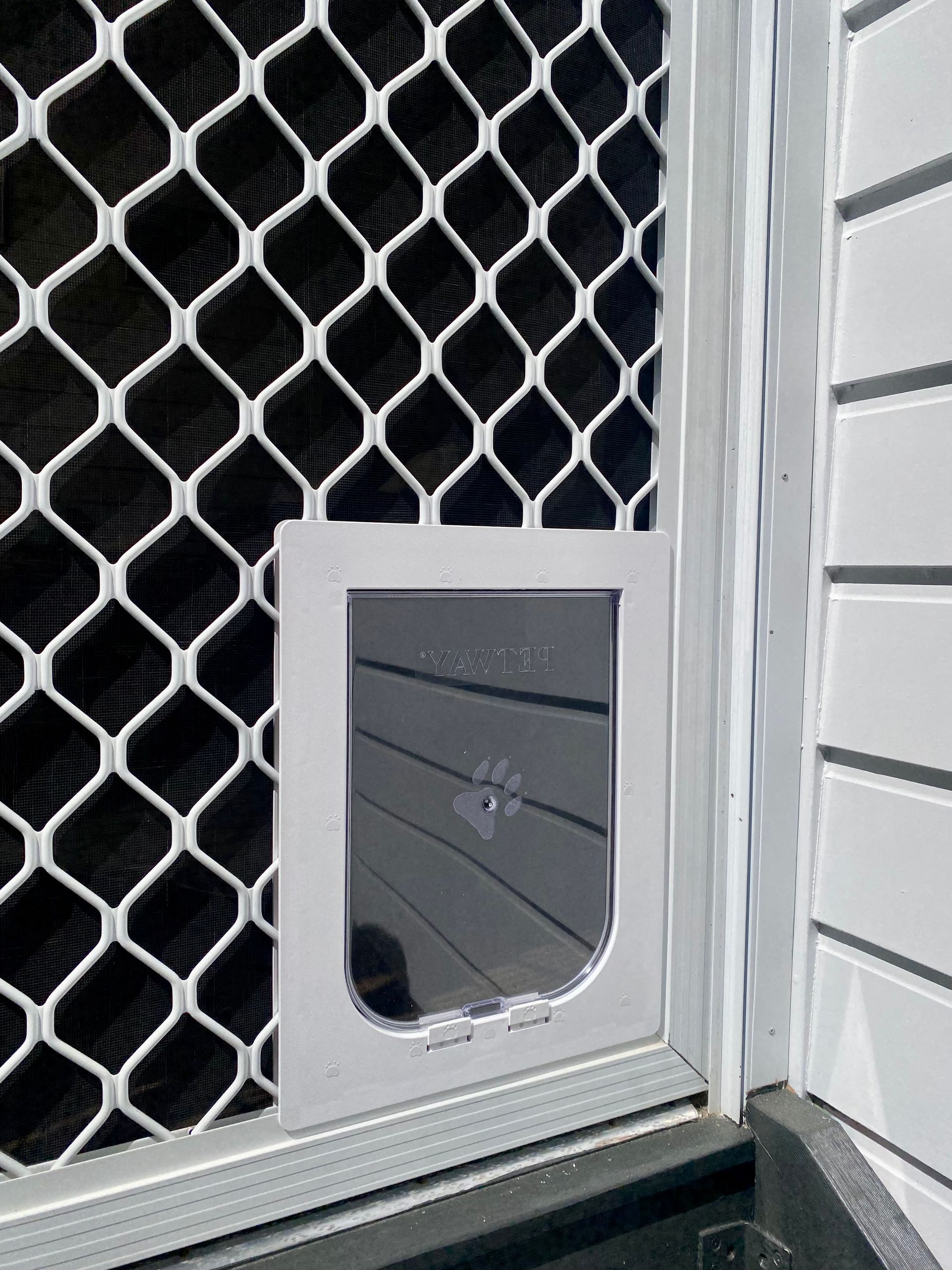 White Screen Door With Cat Flap Installed — Fix-A-Door in Terrigal, NSW