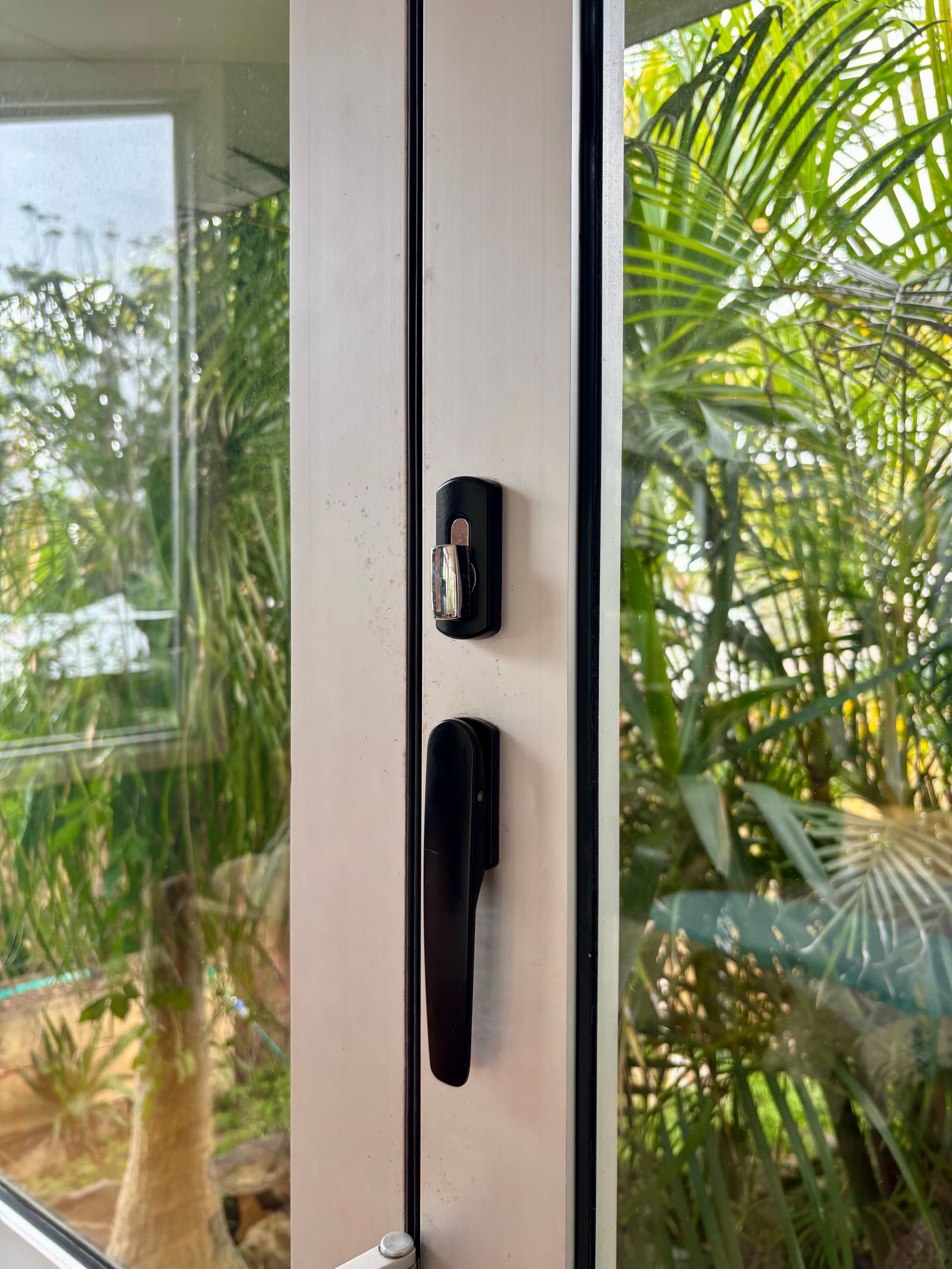 White Window Frame With Black Handles — Fix-A-Door in Cessnock, NSW