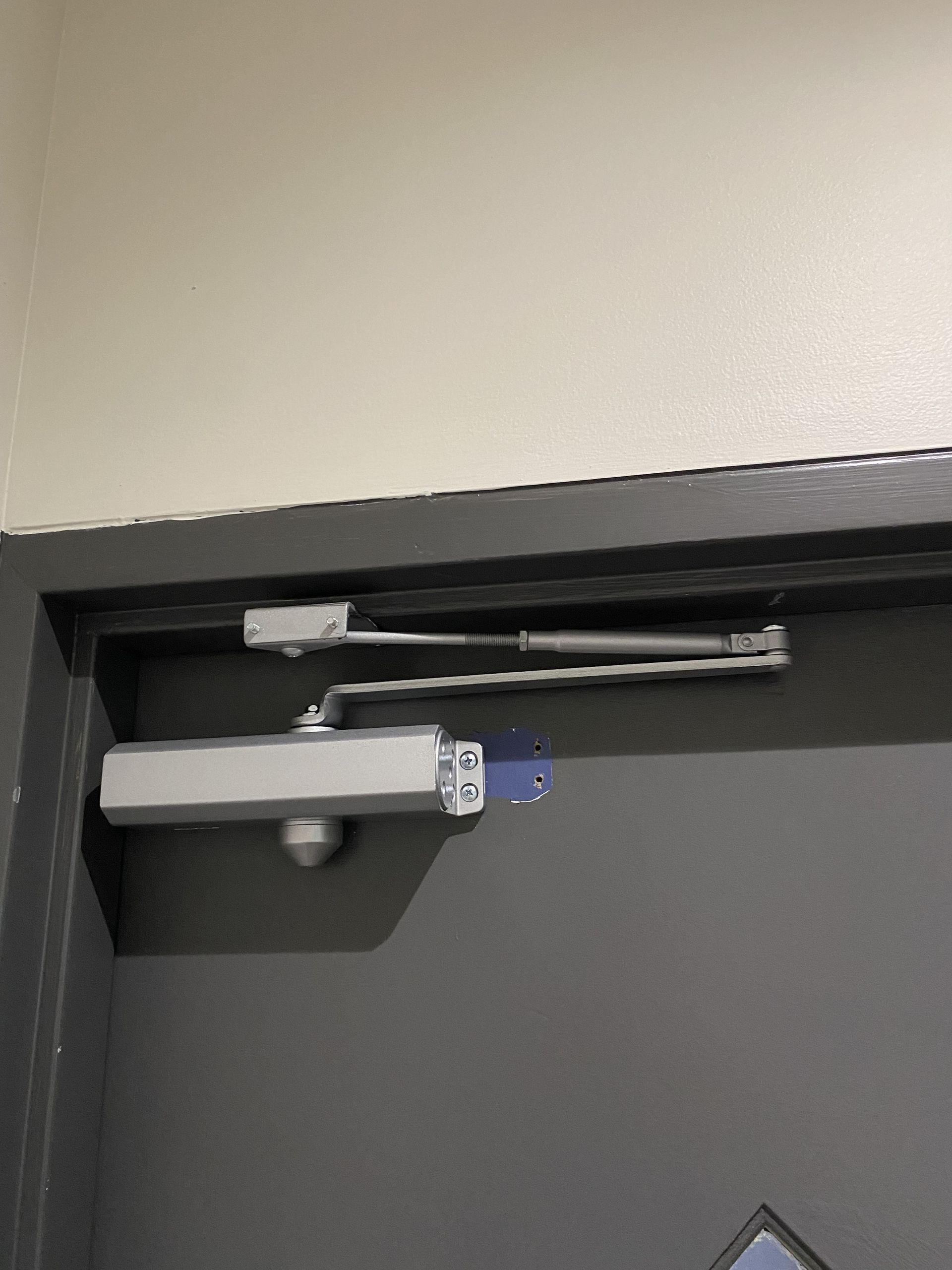 Door With Silver Automatic Closer — Fix-A-Door in Cessnock, NSW