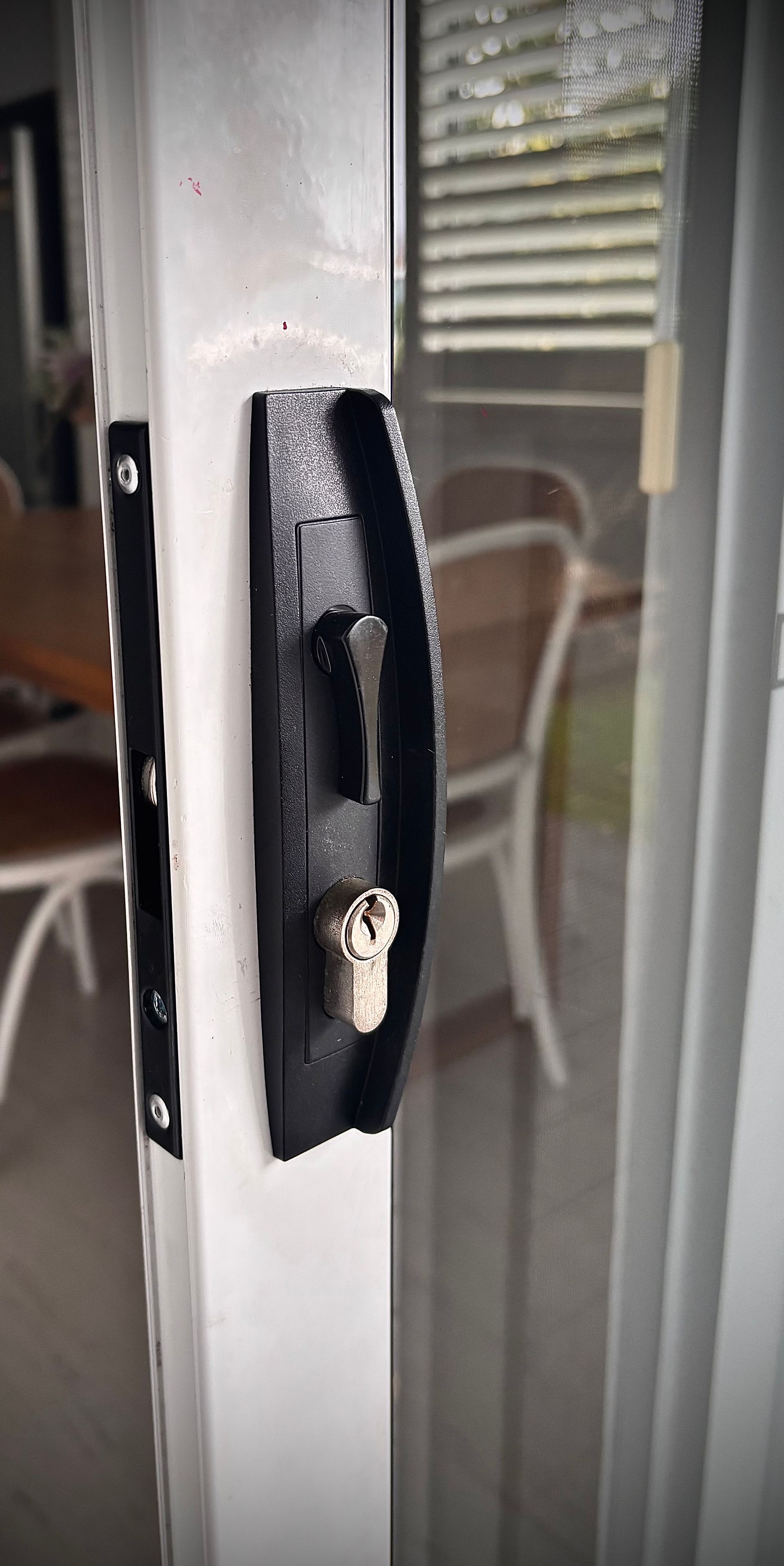 Black Sliding Door Handle On A White Door Frame — Fix-A-Door in Wyong, NSW
