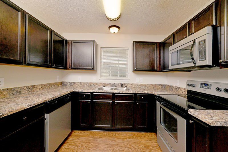 Beacon 2-Bedroom Kitchen Dark Brown Cabinets
