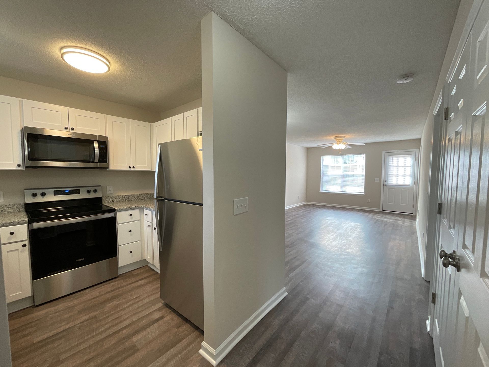 Upgraded Horizon & Crest Kitchen with view of the Living room