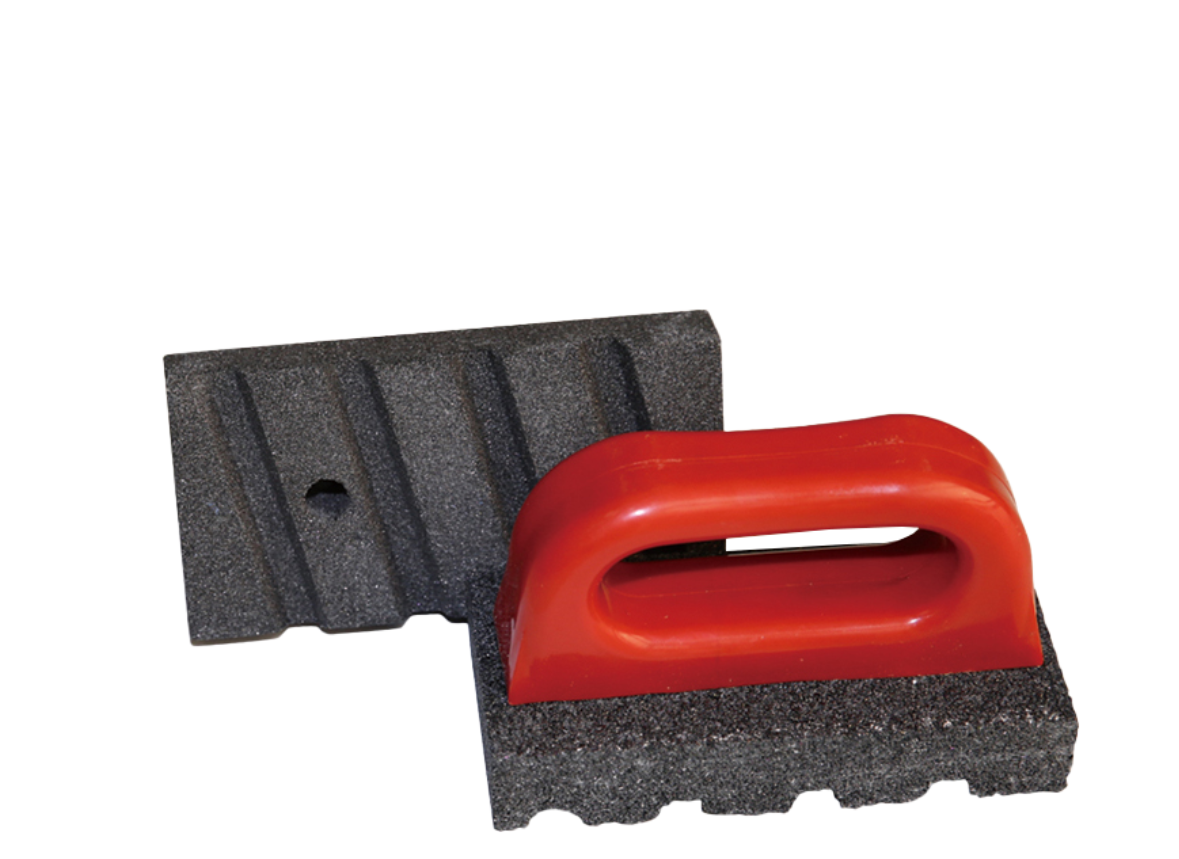 Red-handled grout sponge with two textured dark gray foam blocks.