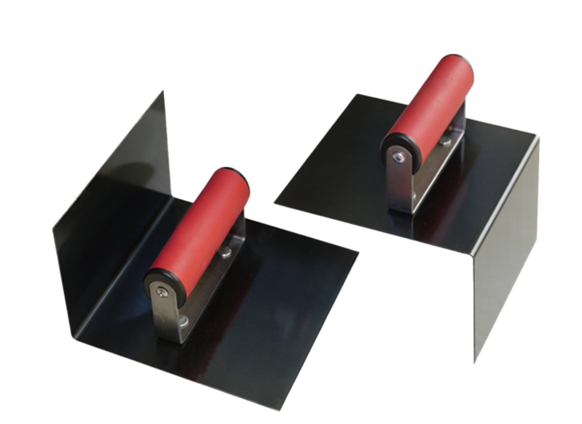 Two metal corner finishing trowels with red handles, for smoothing drywall corners.