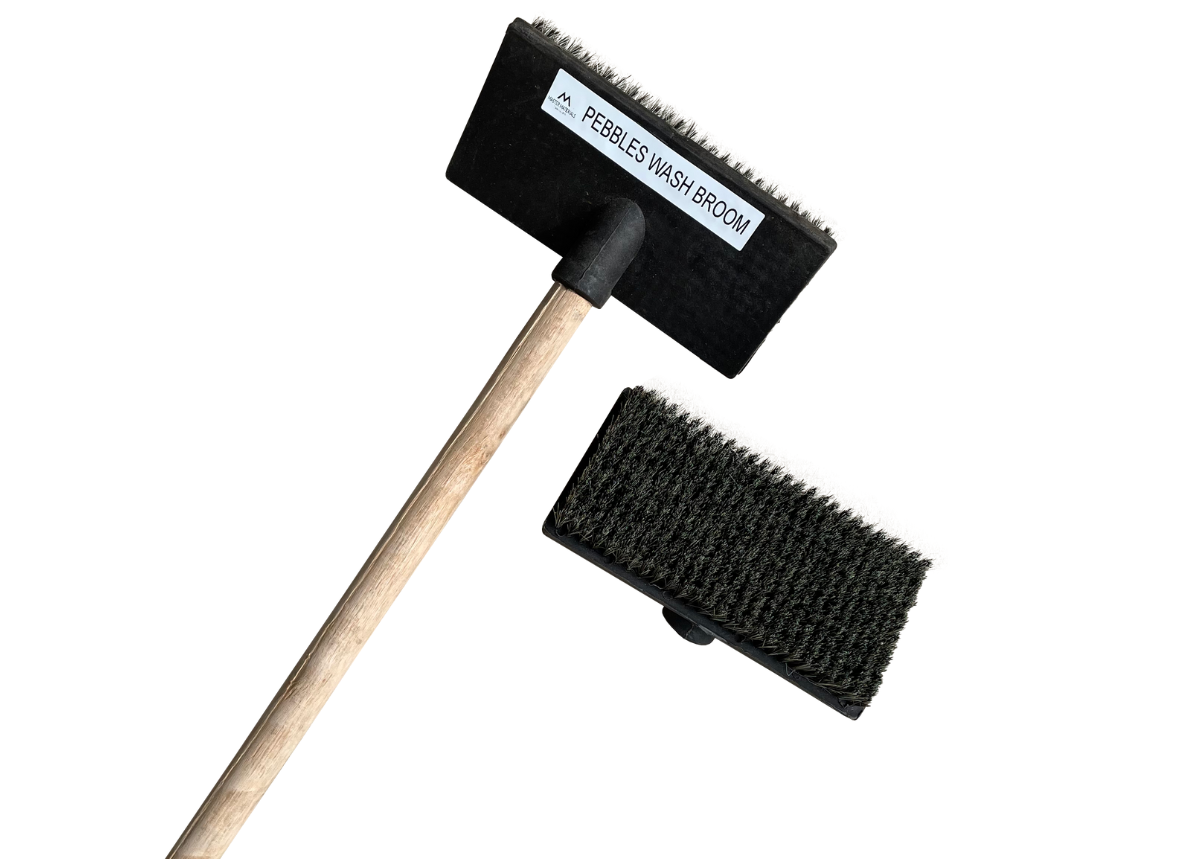 Black scrubbing brush with wooden handle and separate brush head.