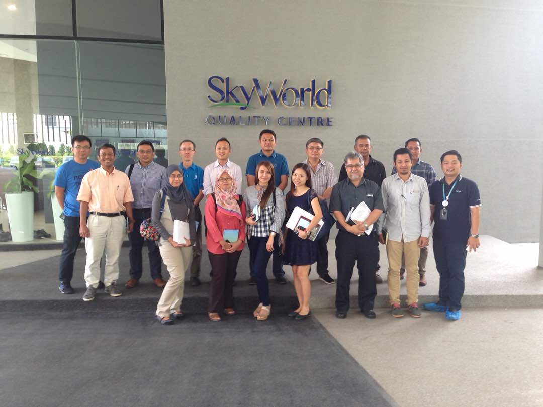 Group of people outside the Skyworld Gallery Centre building.
