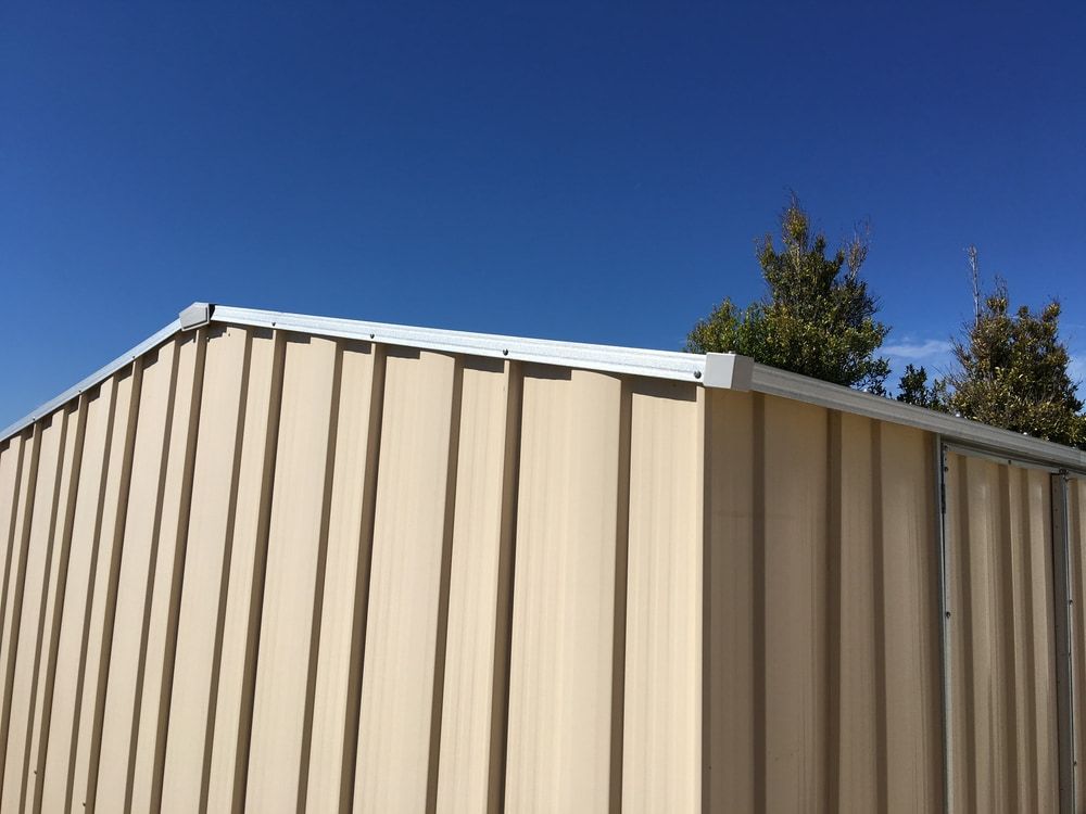Cream Coloured Shed — Handi Skips in Bohle, QLD