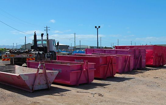 Large Industrial Bins Lined Up in a Row — Skip Bin Hire in Townsville, QLD