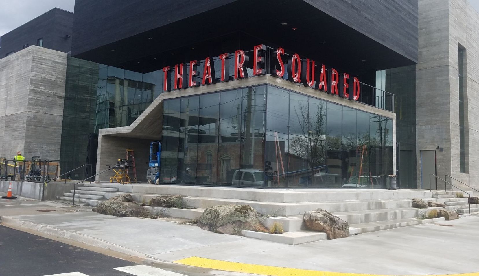 A large building with a sign that says theatre squared on it.