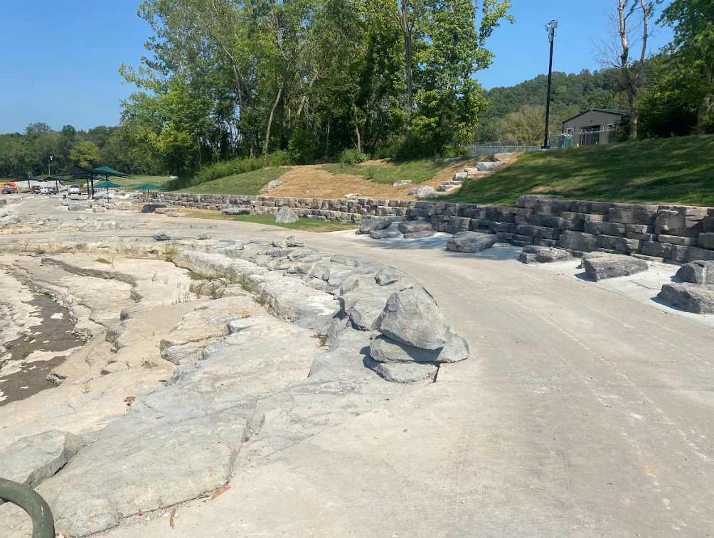 There are a lot of rocks on the ground in the park.