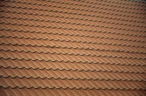 Brown metal roof tiles for a residential property in Wollongong NSW.
