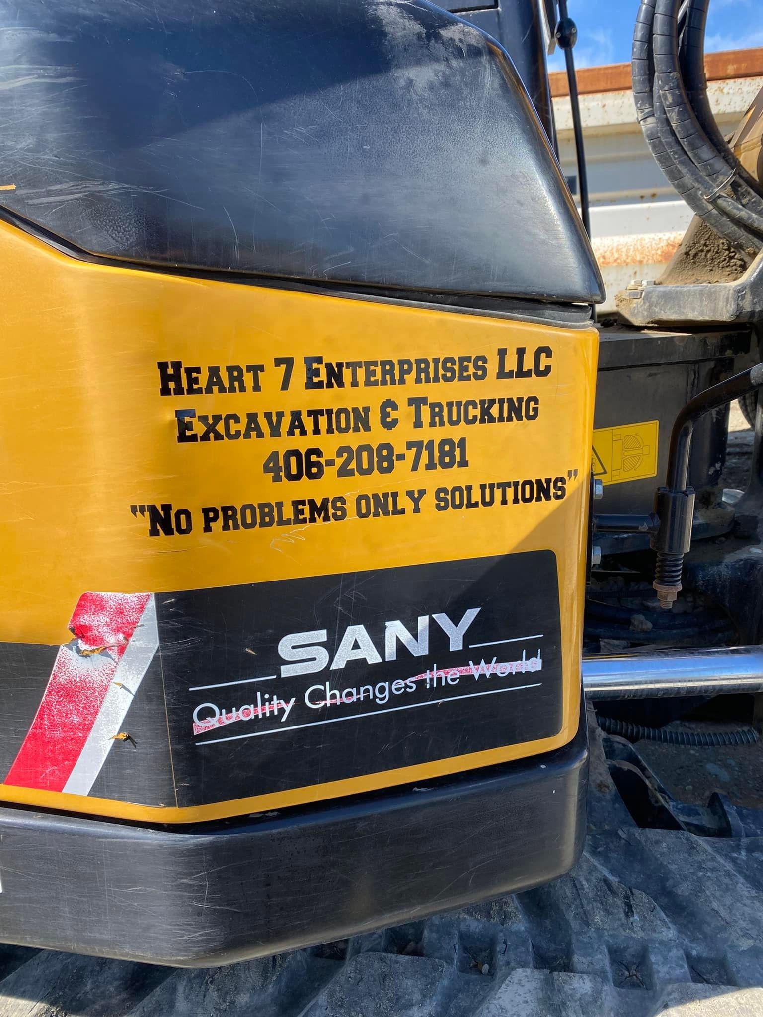 Yellow and black SANY excavator with company logo, 