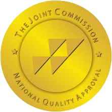 The joint commission national quality approval seal is a gold circle with a triangle in the center.